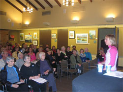 Medea Benjamin addresses a Voices of Women audience at the LJ Library.