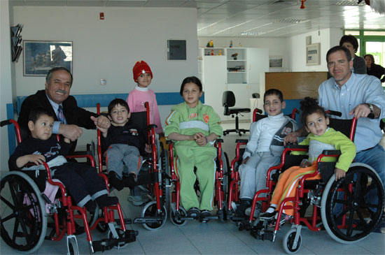 Voices of Women supporter Nader Elbanna (on the left), together with his friend Miko Peled, distributed 1280 wheelchairs last month to  Palestinian and Israeli children in Jerusalem, Nazareth and Bethlehem.