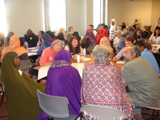 Open Doors, Open Minds.  A table at the conference.